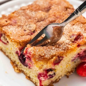 slice of Cranberry Christmas Cake on plate with fork