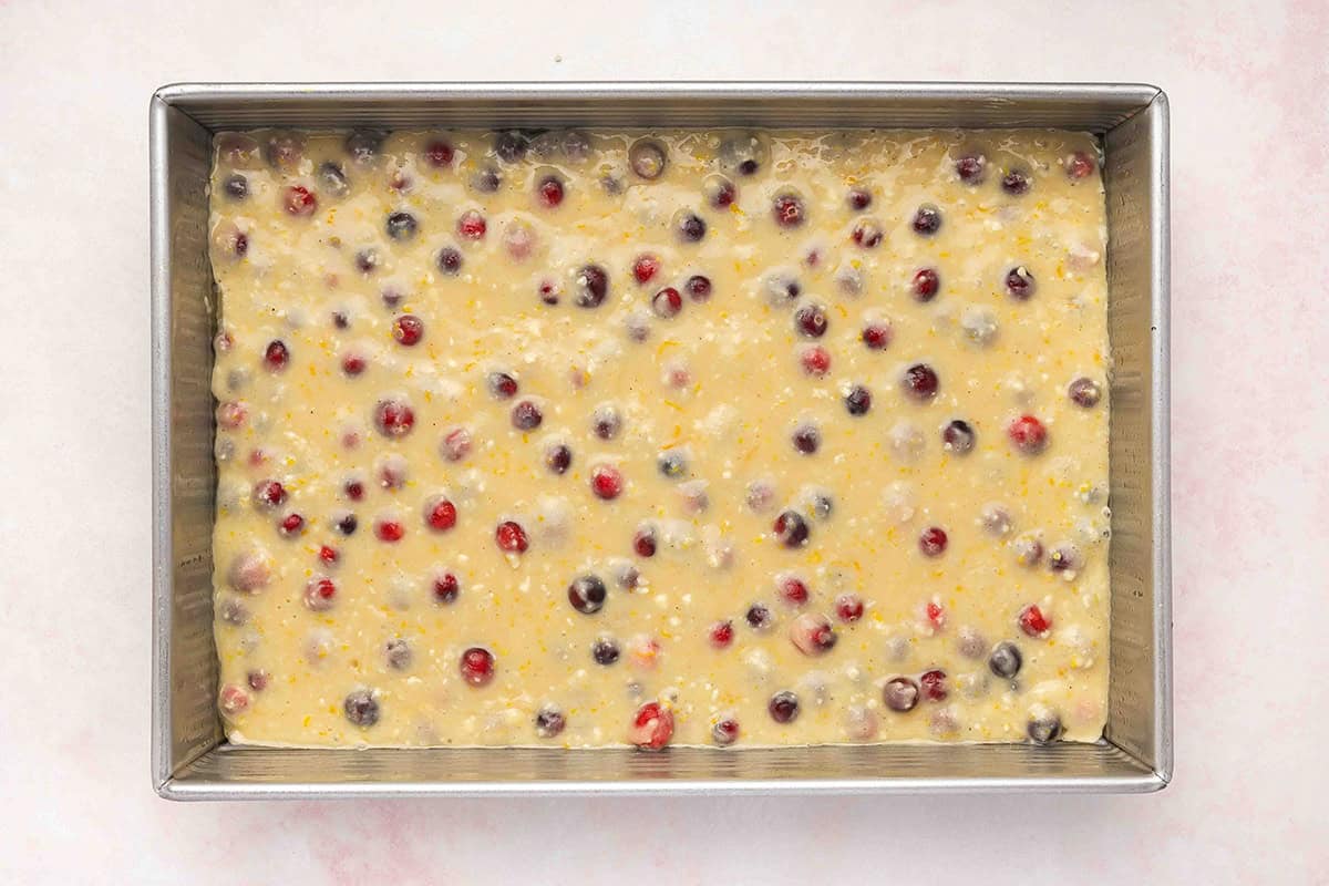 batter for cranberry cake poured into baking pan