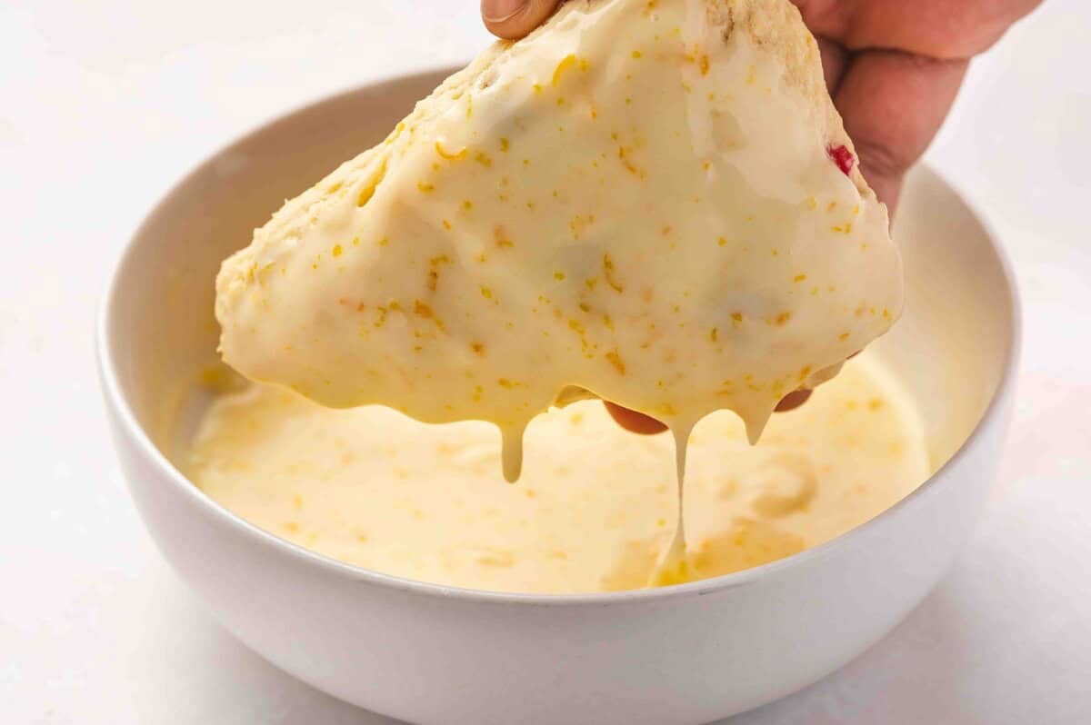 sone being dunked in glaze