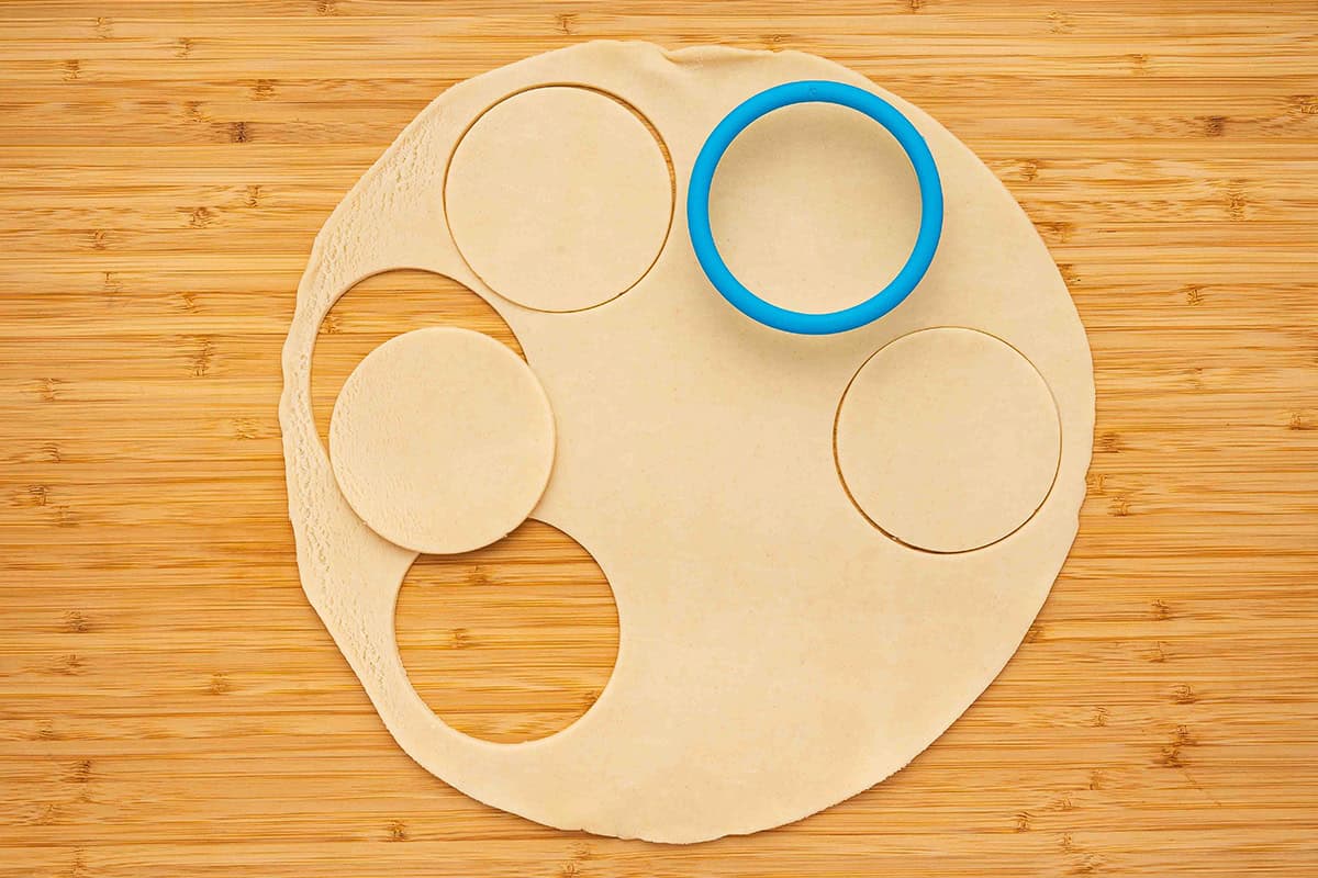 3 inch pie dough circles on cutting board