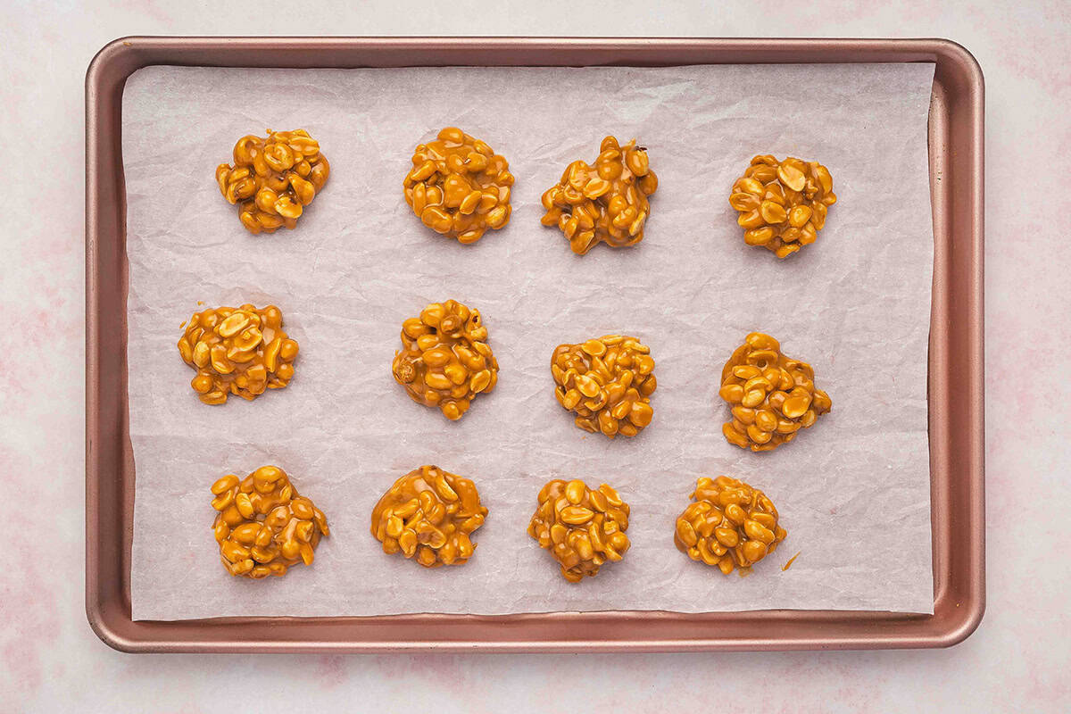 caramel peanut clusters on cookie sheet