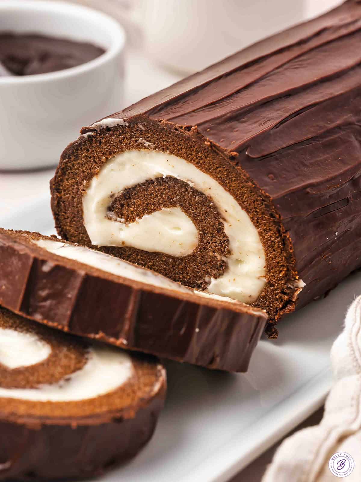 Chocolate Swiss Roll with end cut on serving tray