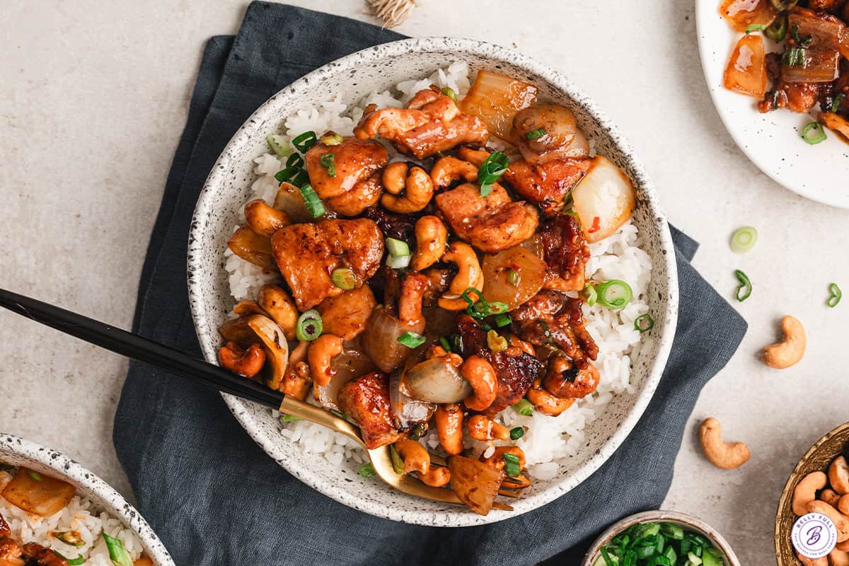 overhead easy cashew chicken in bowl over white rice