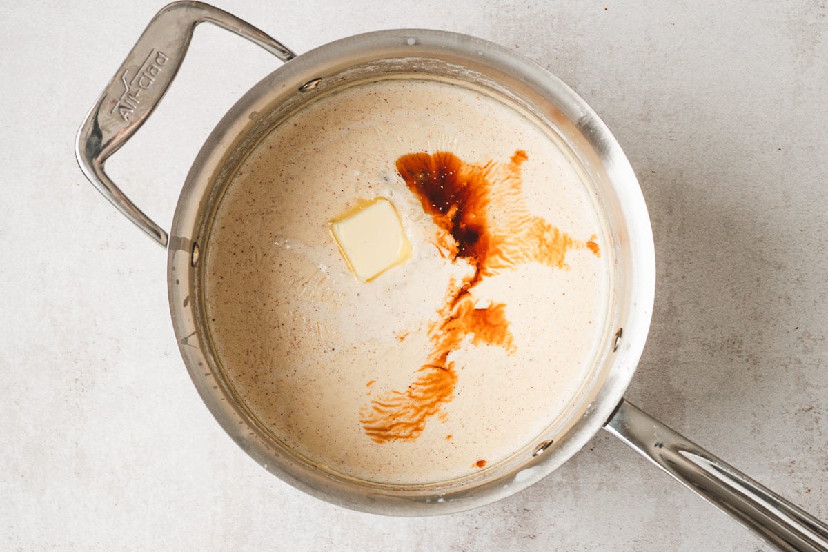 butter and vanilla being added to pot of rice pudding