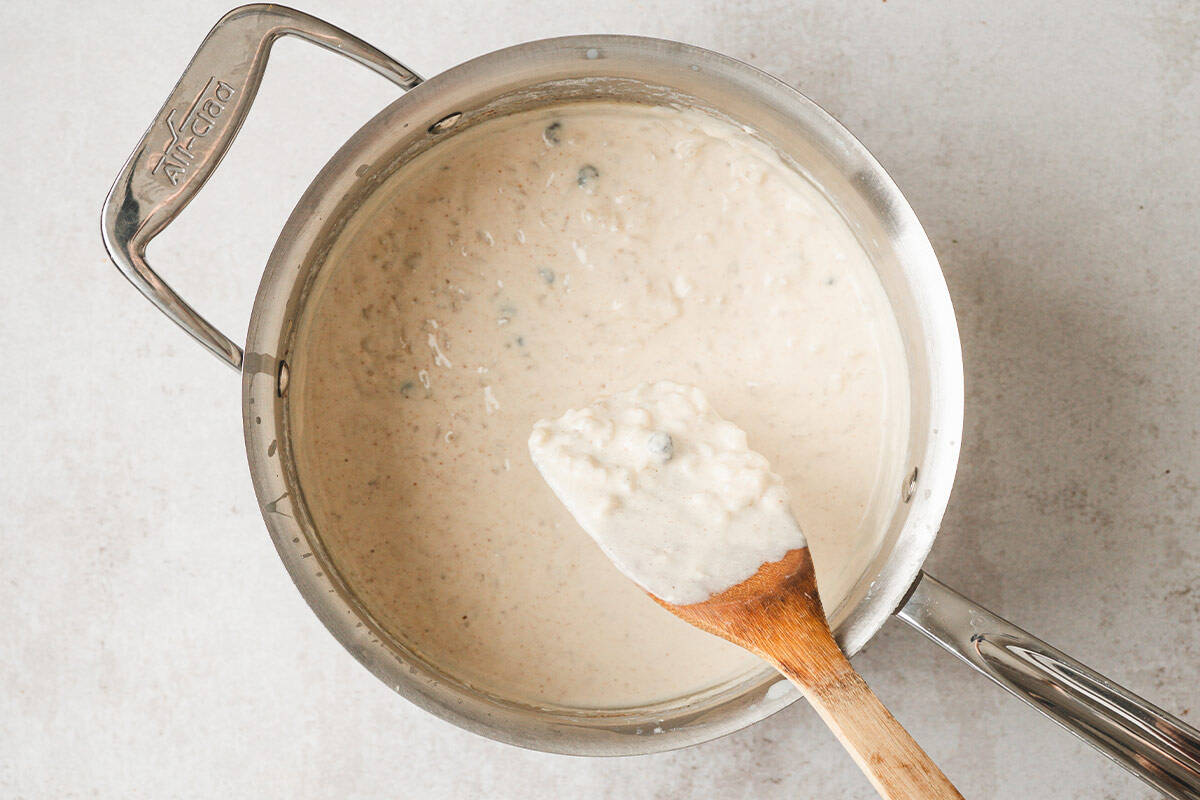 rice pudding being stirred in pot
