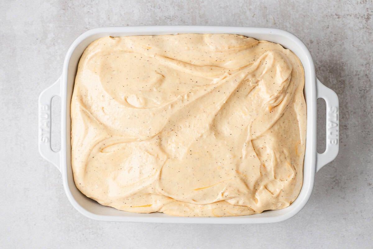 au gratin potato casserole being assembled
