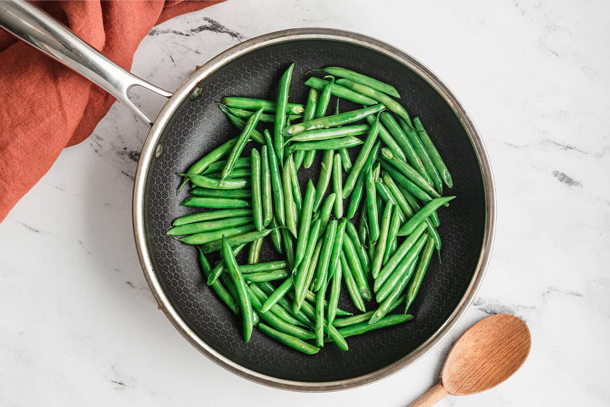 fresh cut green beans in skillet