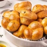 A basket of homemade shortcut cloverleaf rolls.