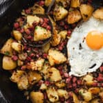 corned beef hash with fried egg in skillet