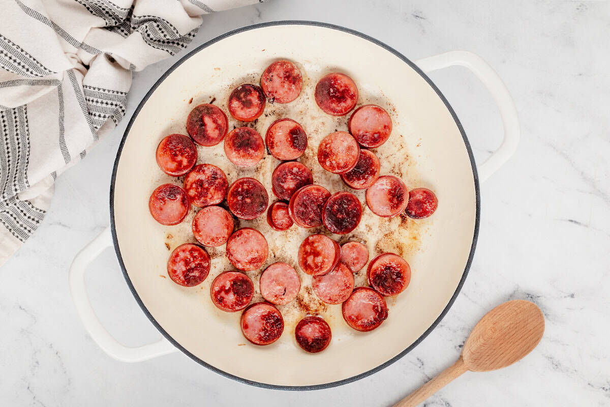 browned sliced kielbasa in skillet