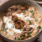 Hungarian Mushroom Soup in bowl with roasted mushrooms as garnish
