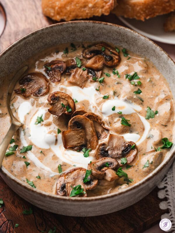 Hungarian Mushroom Soup in bowl with roasted mushrooms as garnish