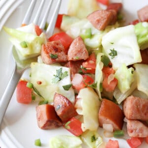 Mexican Kielbasa and Cabbage on plate with fork