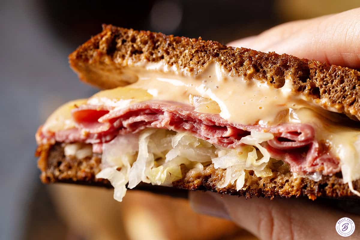 close up center of gooey Reuben Sandwich