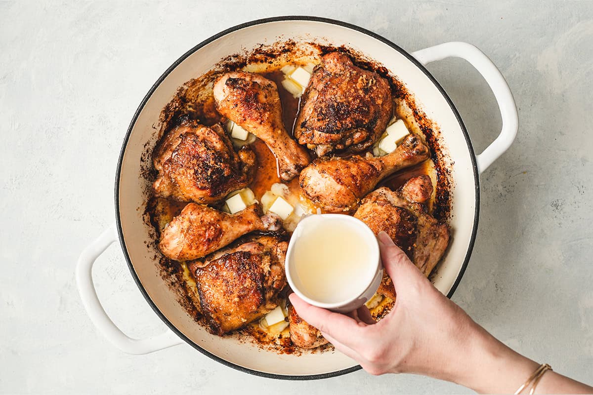 Butter cubes and fresh lemon juice added to roasted chicken to create a buttery lemon pan sauce