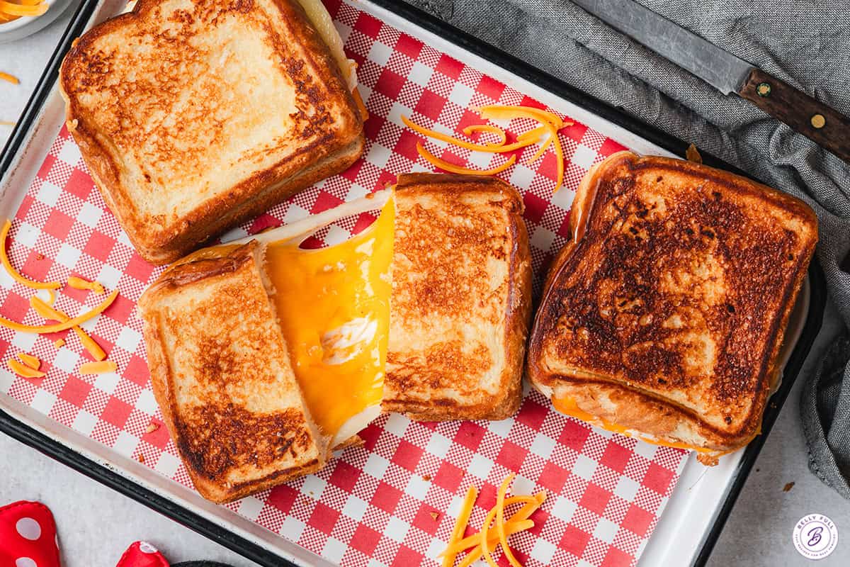 Overhead view of three Disneyland copycat grilled cheese sandwiches.