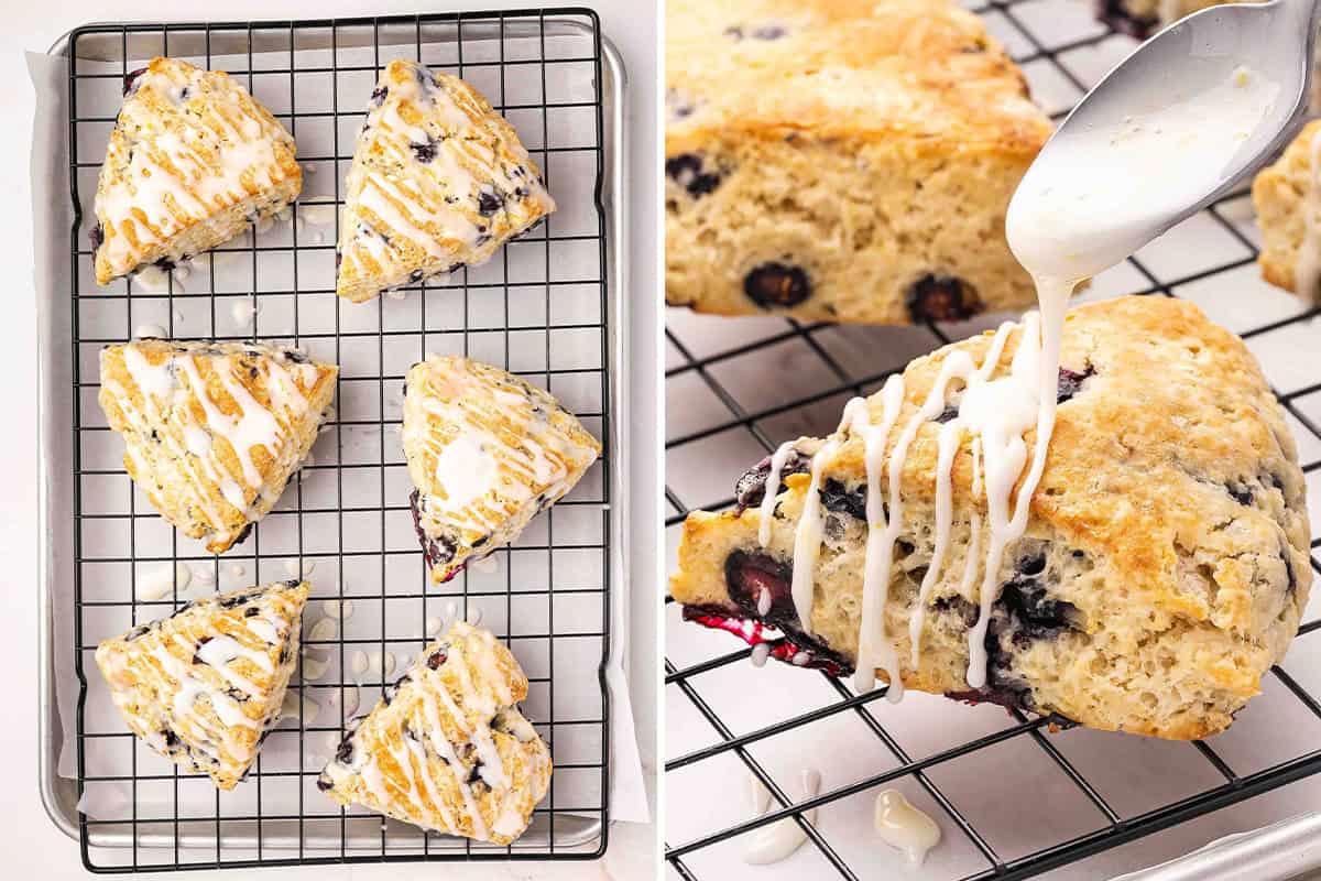 Freshly baked lemon blueberry scones on a rack with lemon glaze being drizzled over the top and setting as they cool.