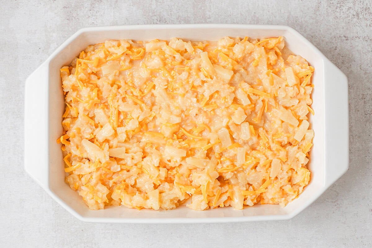 Homemade pineapple casserole filling in a baking dish.