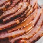 A baked ham covered in pineapple ham glaze.