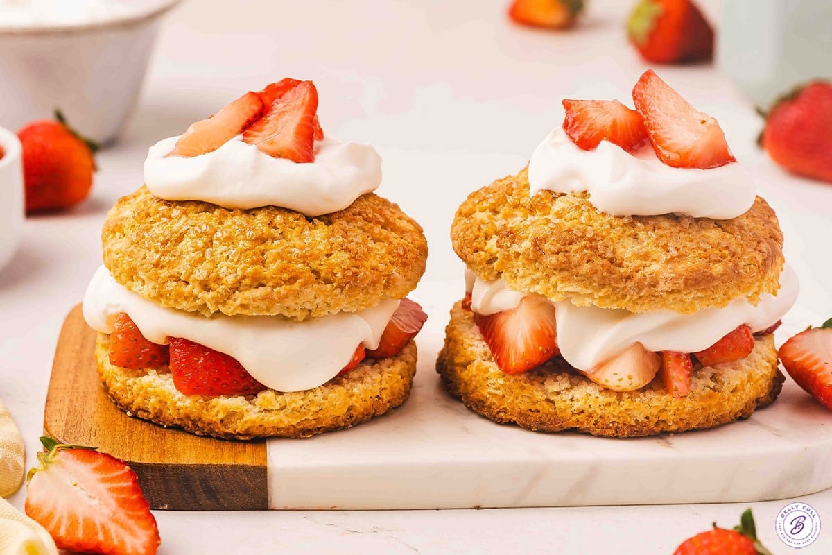Side view of two homemade strawberry shortcakes.