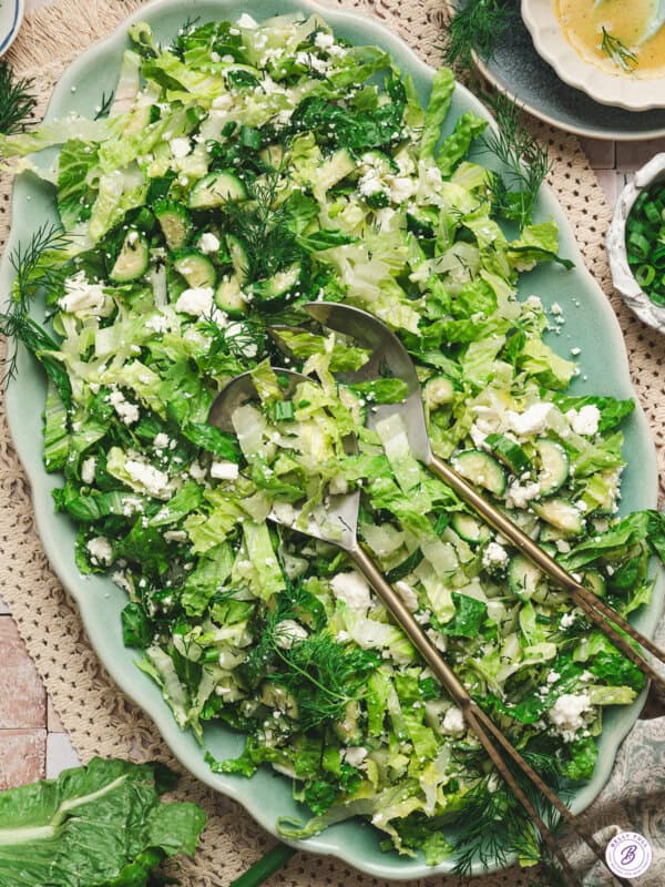 Overhead view of maroulosalata salad on a platter.