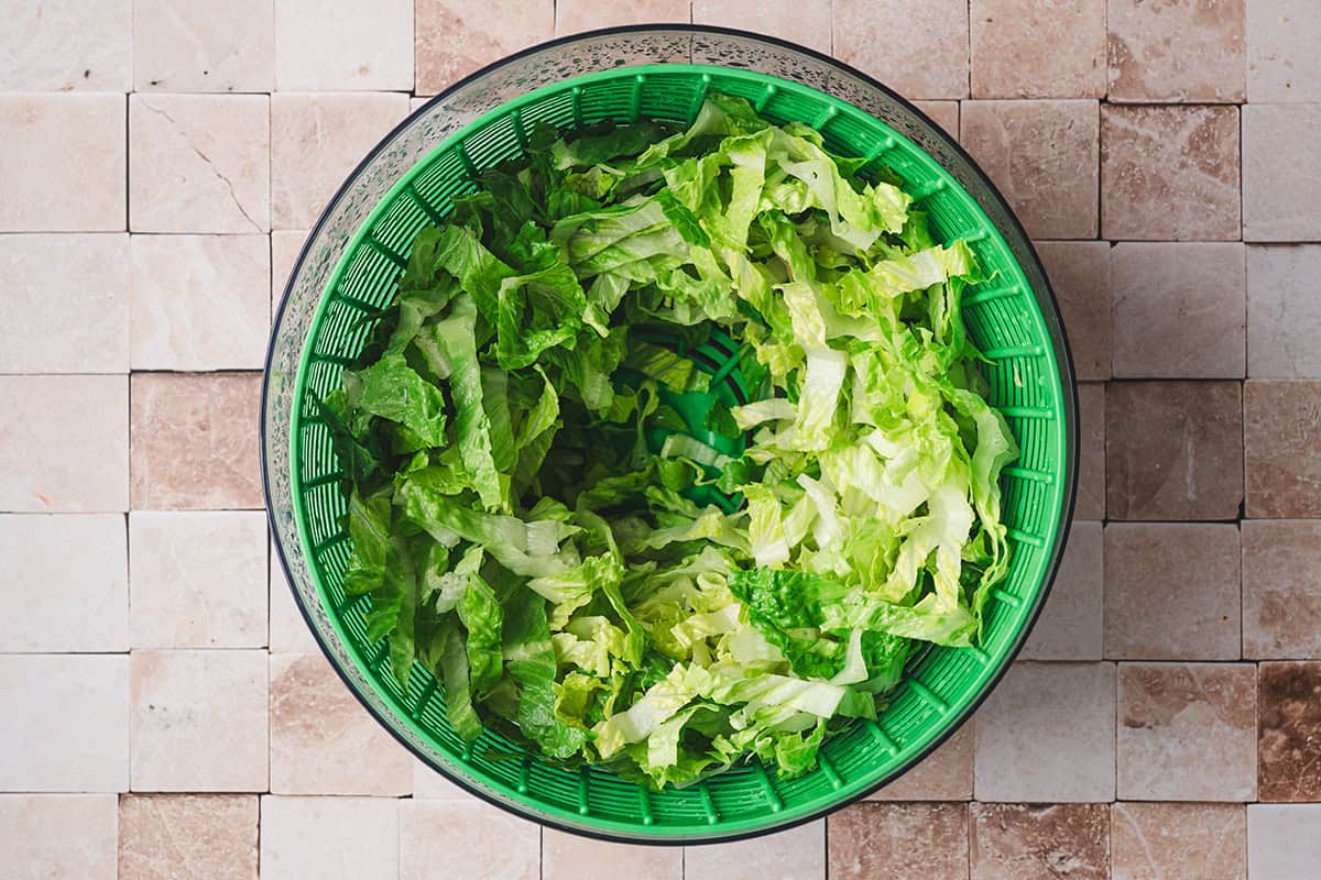 Shredded lettuce in a salad spinner.
