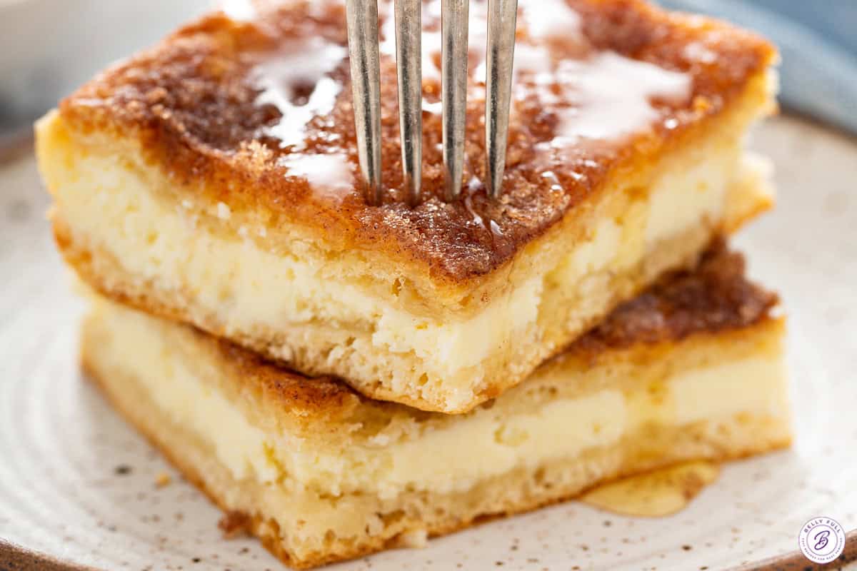 Sopapilla Cheesecake being bit into with a fork