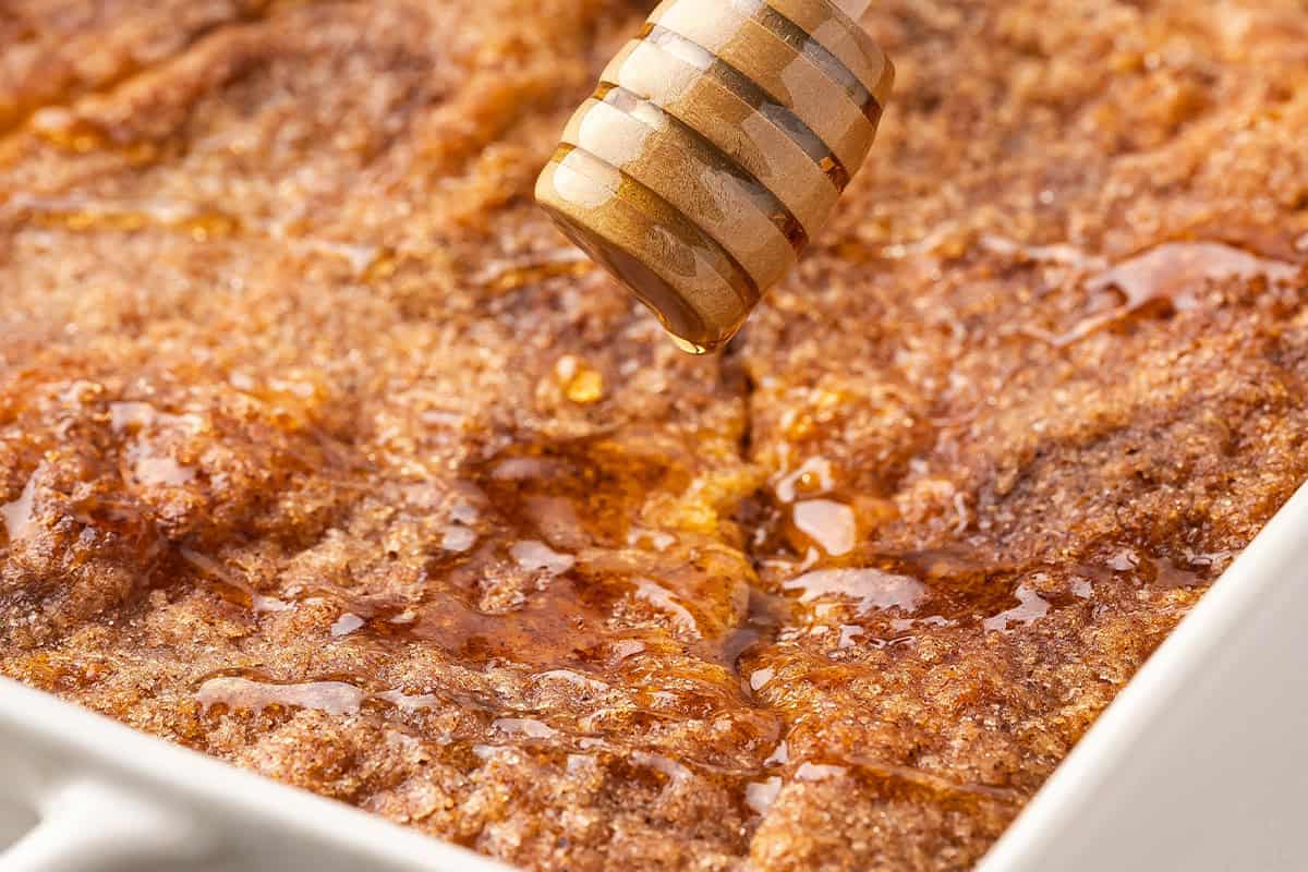 drizzle honey onto Sopapilla Cheesecake