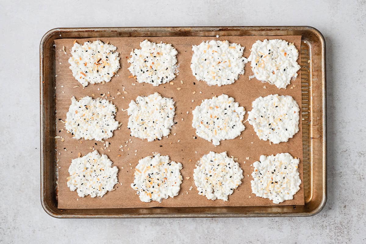 Overhead view of cottage cheese rounds topped with everything bagel seasoning.