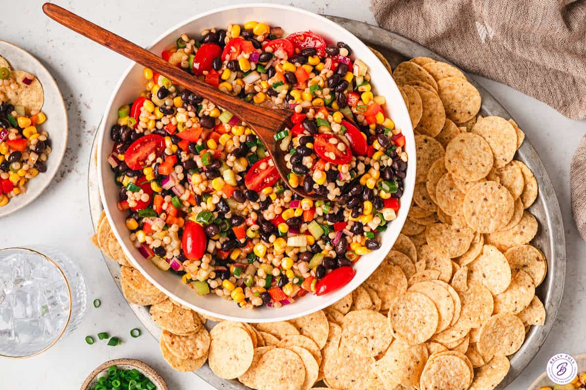 cowboy caviar couscous salad with tortilla chips