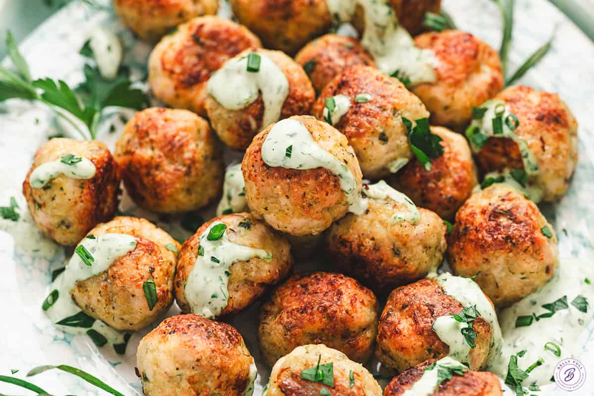 Green goddess meatballs on a plate.