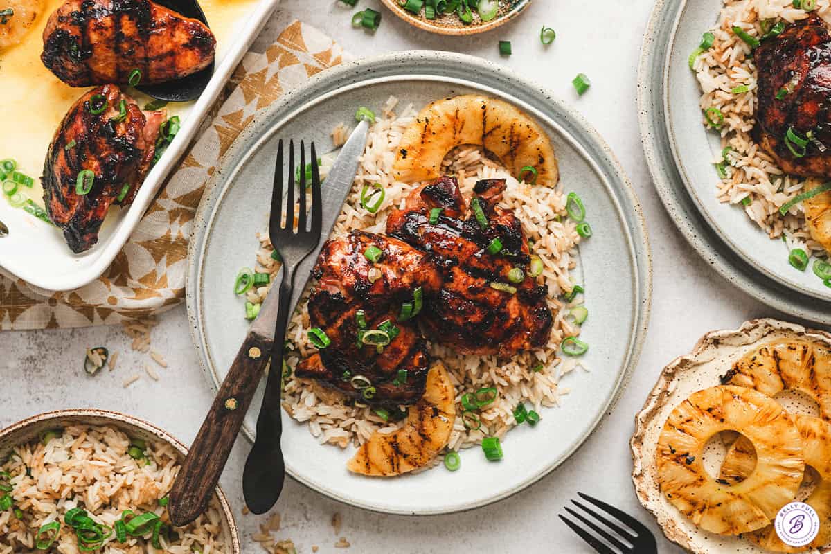 Grilled Hawaiian chicken thighs served over rice with grilled pineapple and green onions