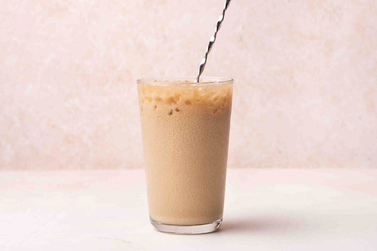 A dirty soda with a straw.