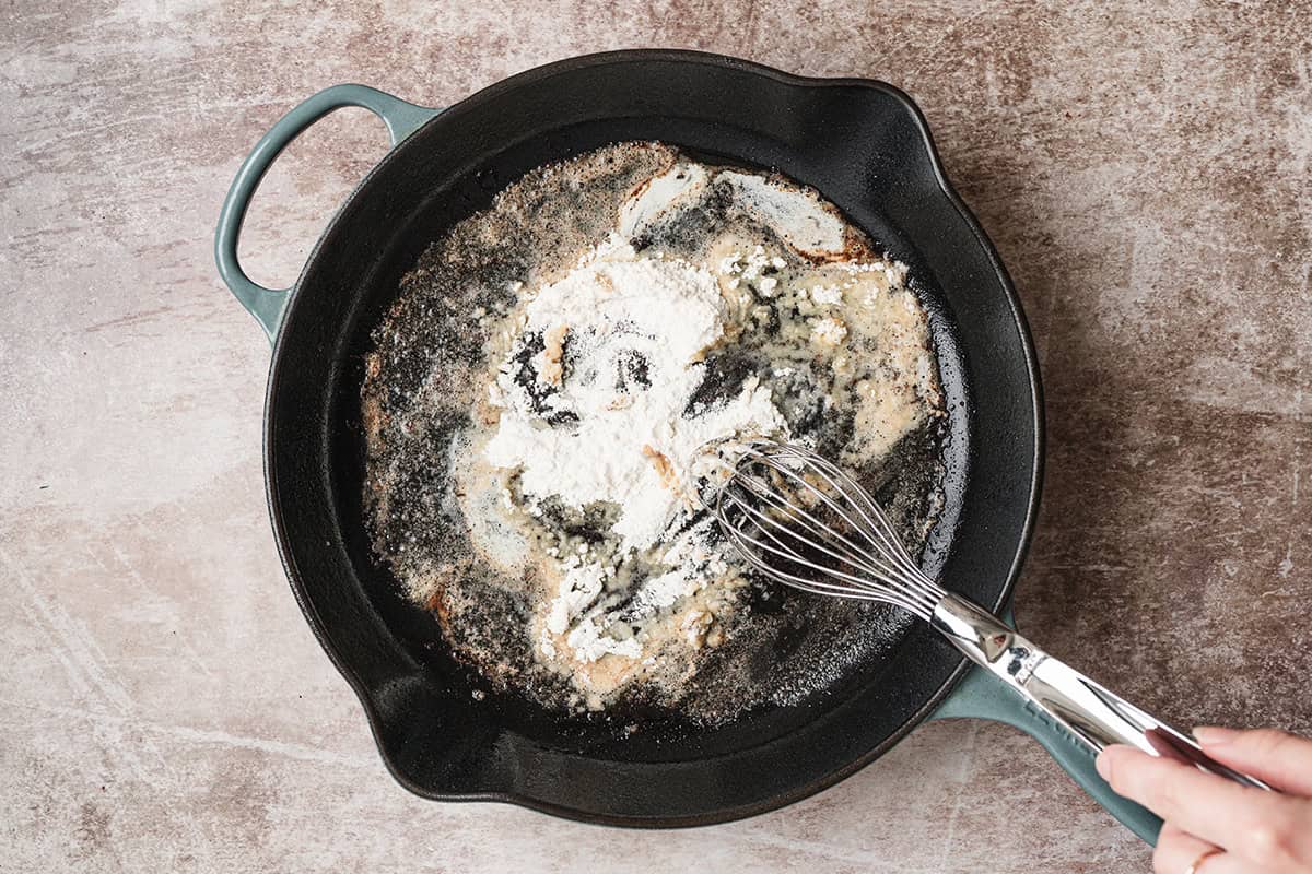 Butter and flour whisked together in a skillet to start the homemade gravy.