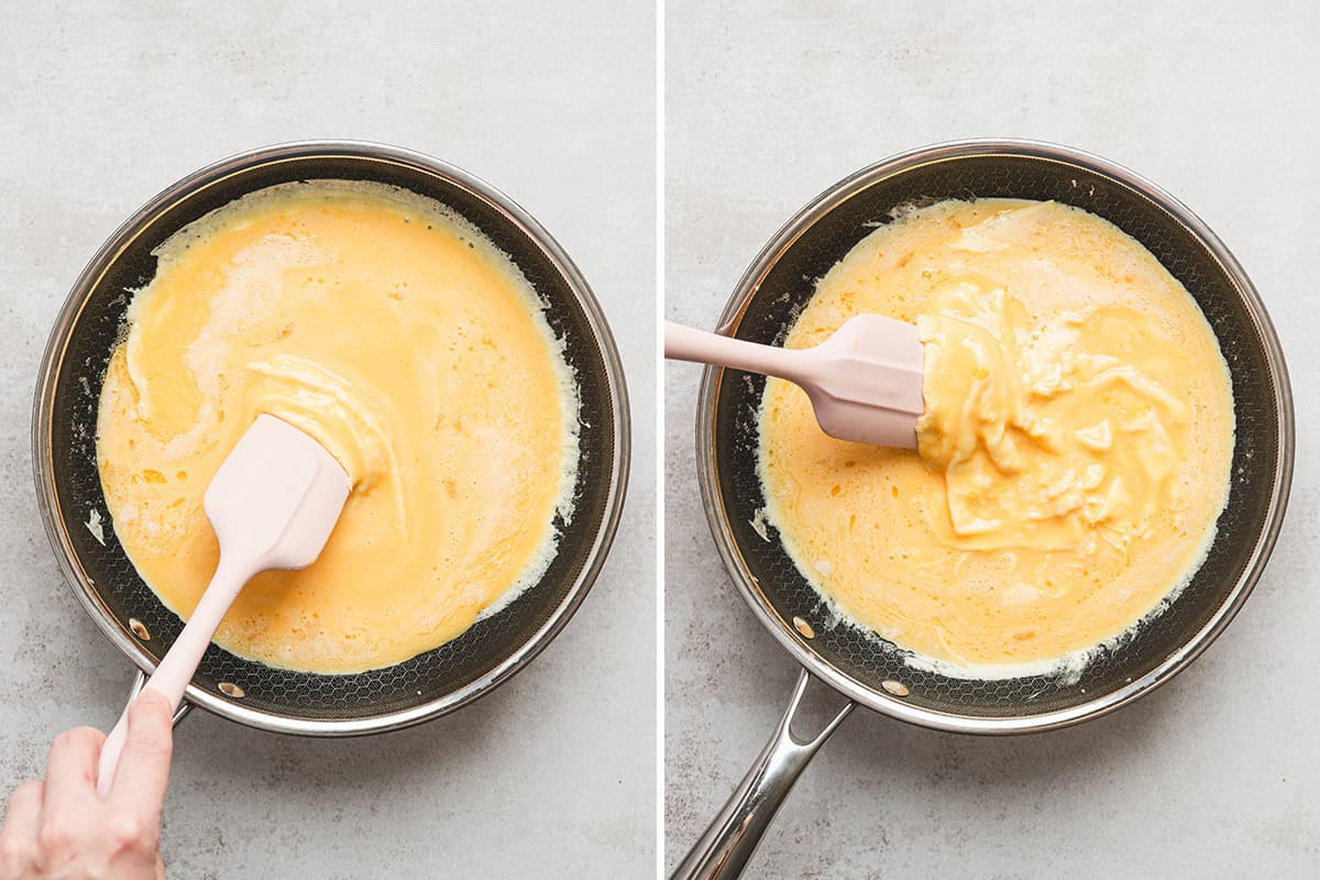 Soft scrambled eggs beginning to form curds in a nonstick skillet with a rubber spatula.