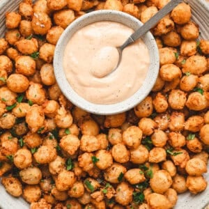 Bloomin onion bites on a plate with comeback sauce.