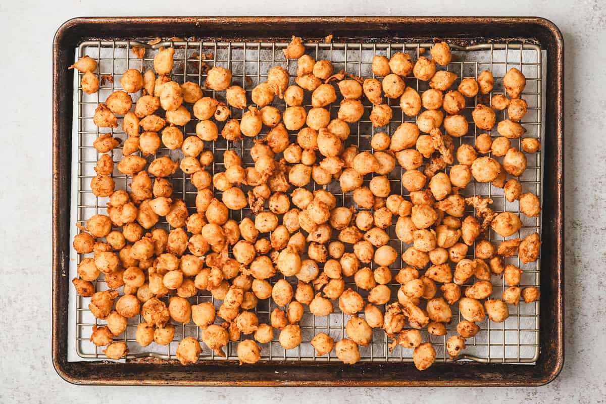 Bloomin onion bites on a baking sheet.