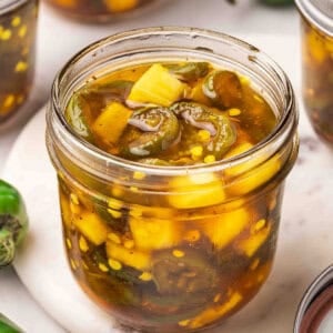 Overside sideview of an open jar of cowgirl candy.