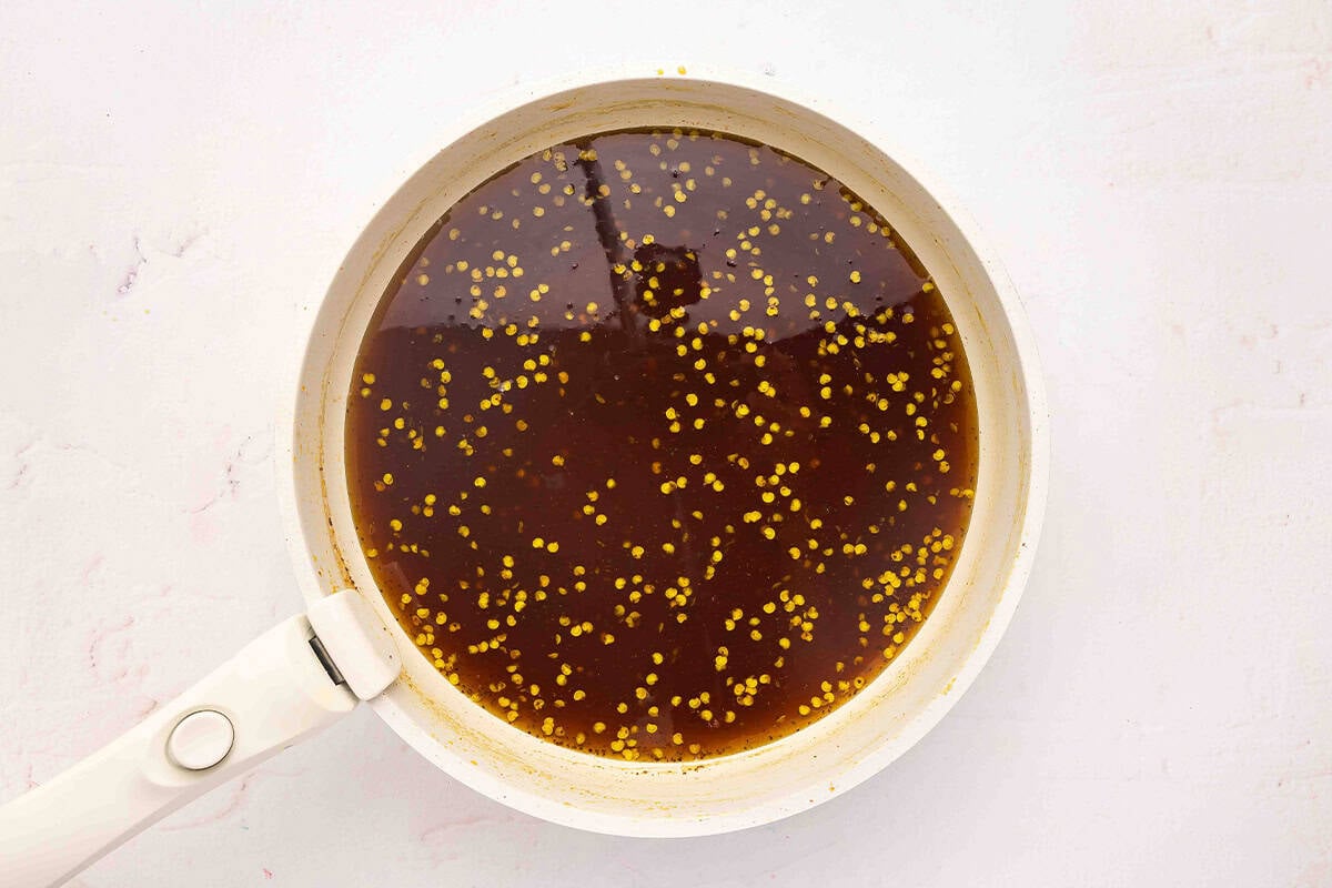 Jalapeno syrup in a sauce pan.