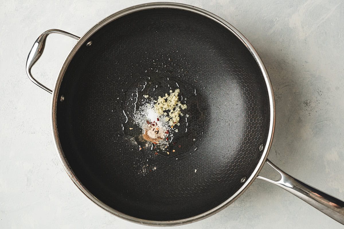 Ginger, red pepper flakes, salt and white pepper in a skillet.