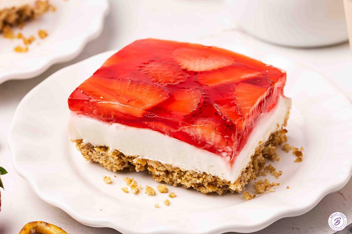 Side view of a slice of strawberry pretzel salad.