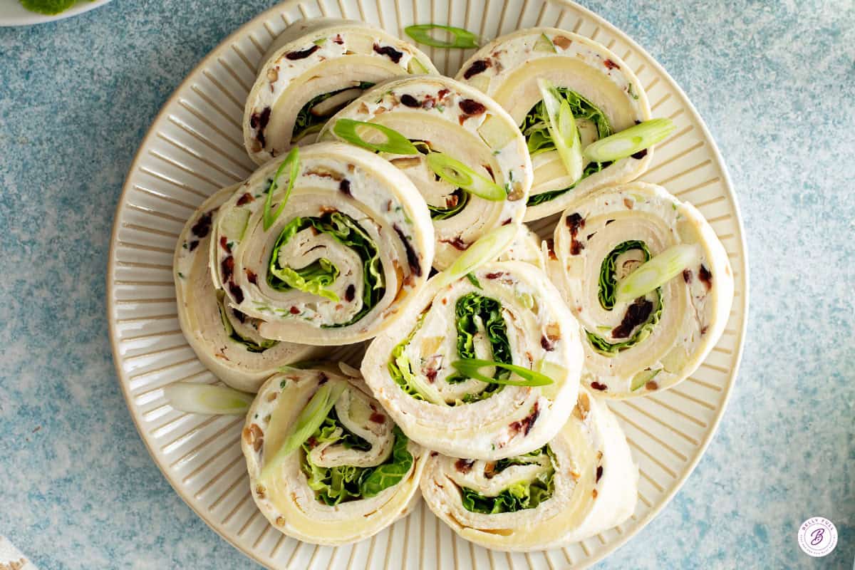 overhead view of chicken salad pinwheels on serving plate