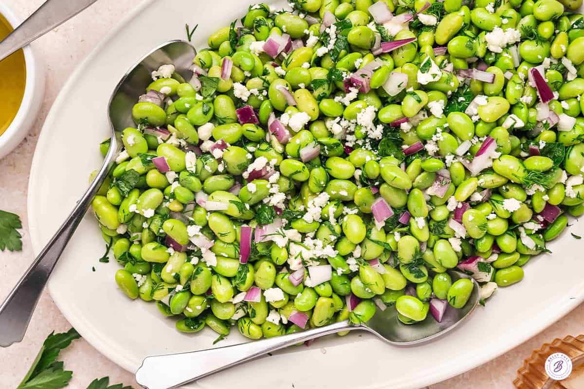 Overhead view of an edamame salad on a platter.