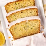 Overhead view of lemon zucchini bread with half cut into slices.