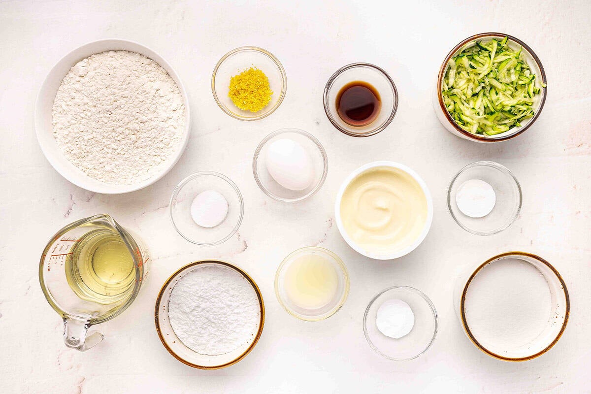 The ingredients to make a lemon zucchini loaf.