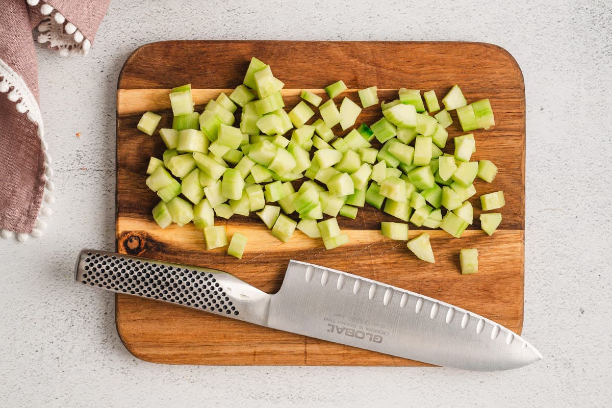 diced cucumber on cutting board