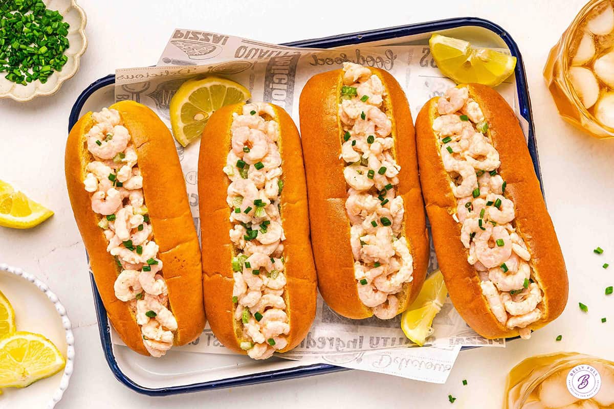 Overhead view of four homemade shrimp rolls.