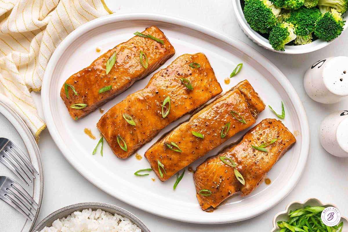 Overhead view of brown sugar glazed salmon on a platter.